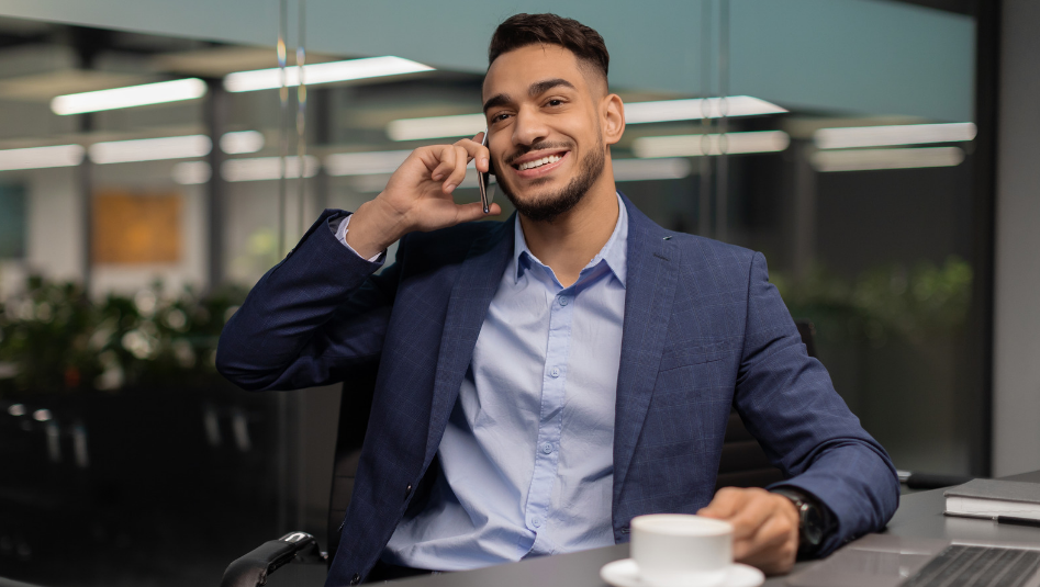 Entrepreneur discussing business plans over the phone in an office
